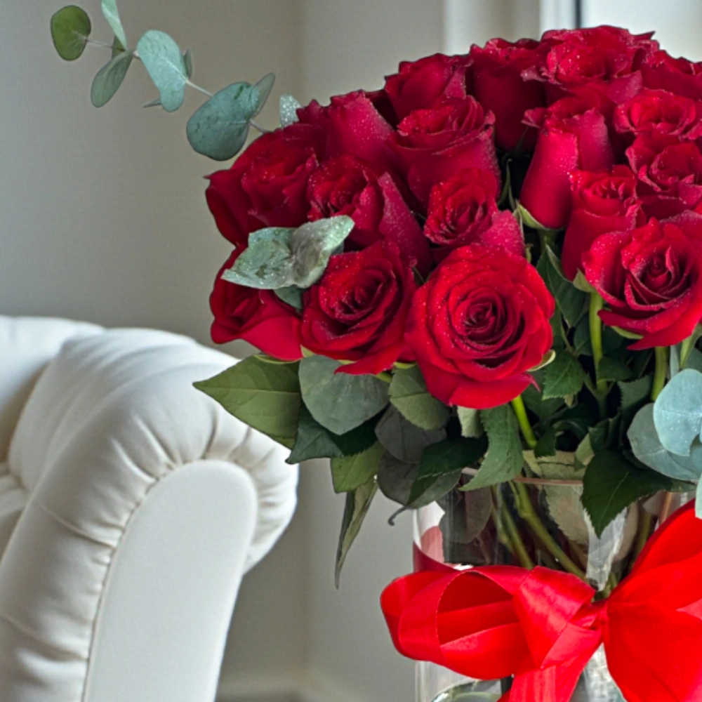 Bunch of 51 red rose with fillers in a glass vase