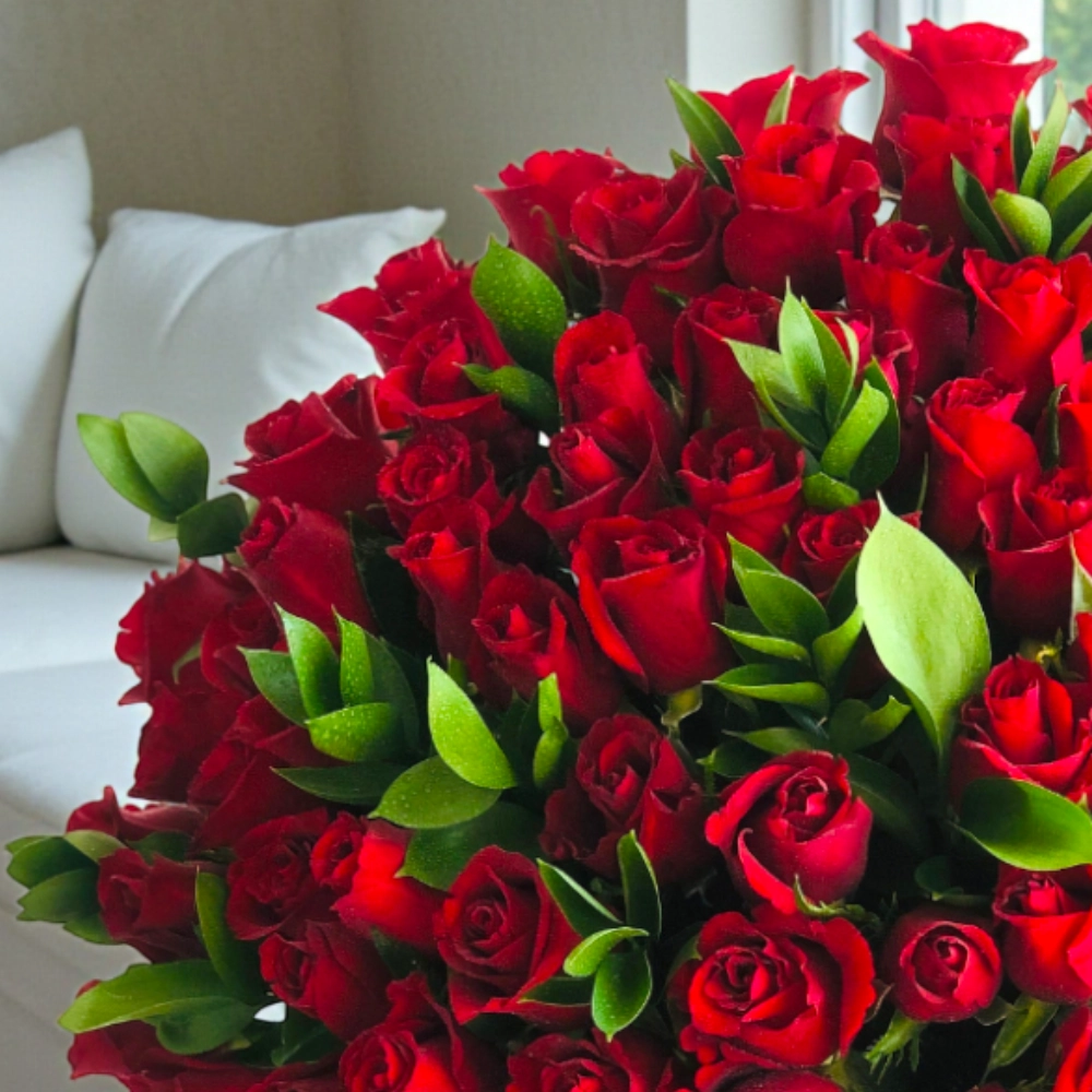 Arrangement of 100 red roses in a black box